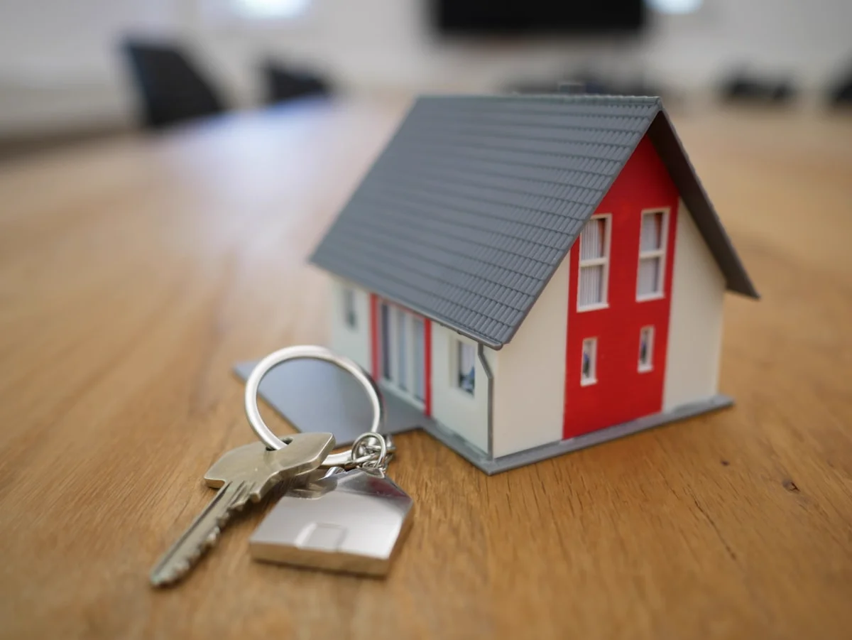 Real estate investor receiving keys to a rental property financed with a DSCR loan
